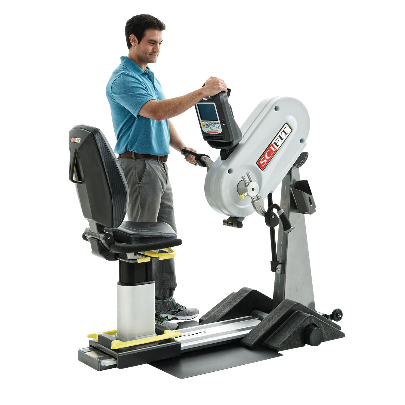 A person adjusts the SciFit PRO1 Upper Body Exerciser, a machine with a seat and hand-operated controls for upper body workouts.