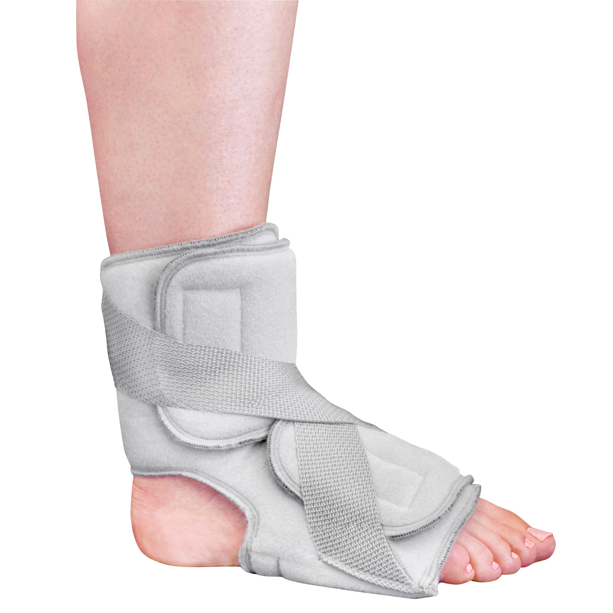 A foot and ankle are fitted with the Nice Stretch Total Solution PF Kit, featuring adjustable gray straps and padding for support.
