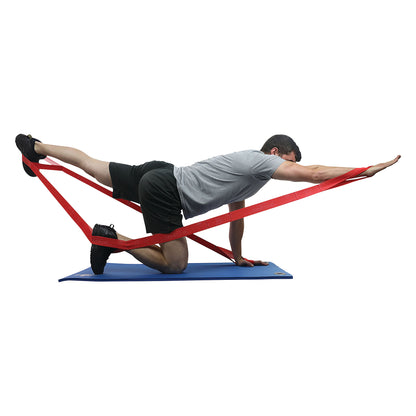 A person does a resistance exercise using the CanDo Multi-Grip Exerciser, extending one arm and opposite leg on a blue mat.