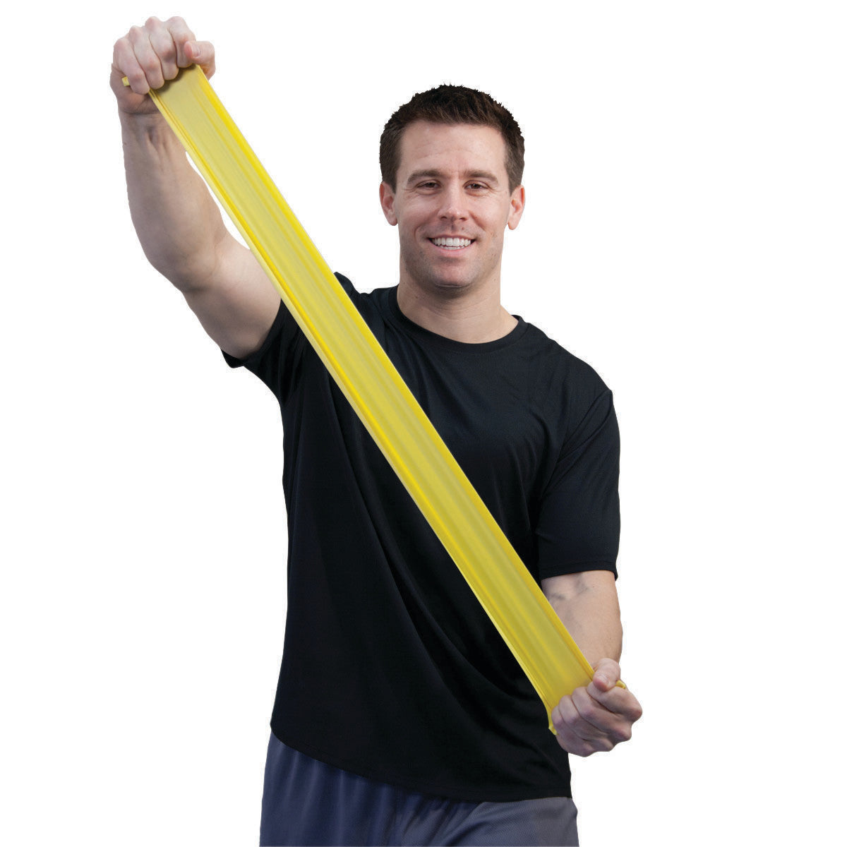 A person in a black shirt stretches a yellow CanDo Sup-R Band Non-Latex Exercise Band against a white background.