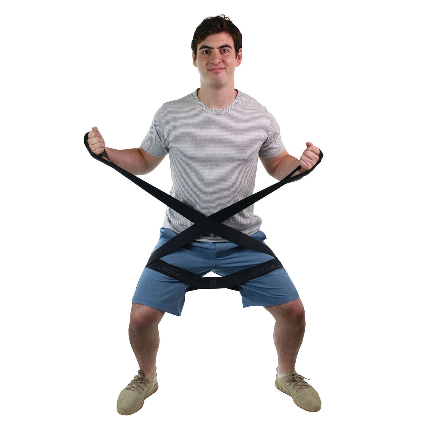 A man in a squat position uses the CanDo Multi-Grip Exerciser, holding the bands crossed around his waist and legs.