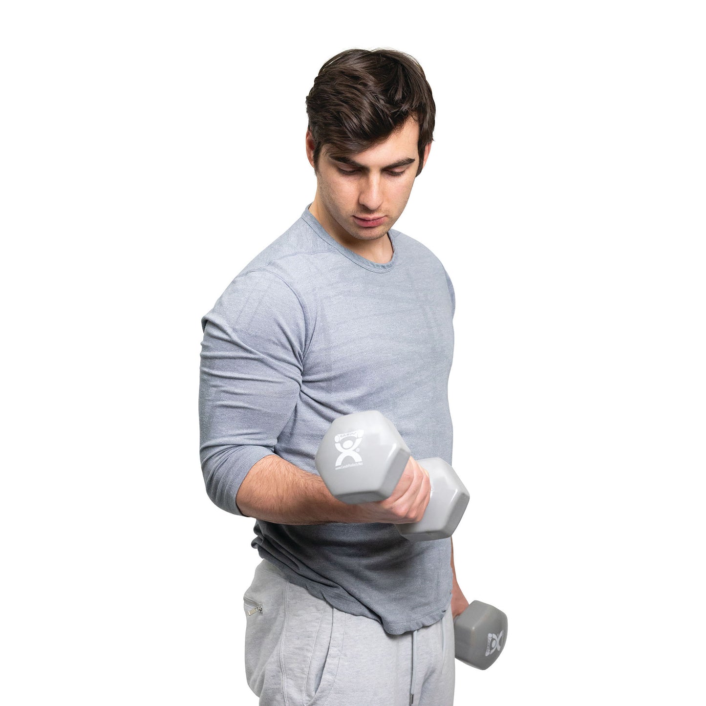 A man in a light gray shirt lifts a CanDo Vinyl-Coated Dumbbell while holding another in his other hand against a white background.