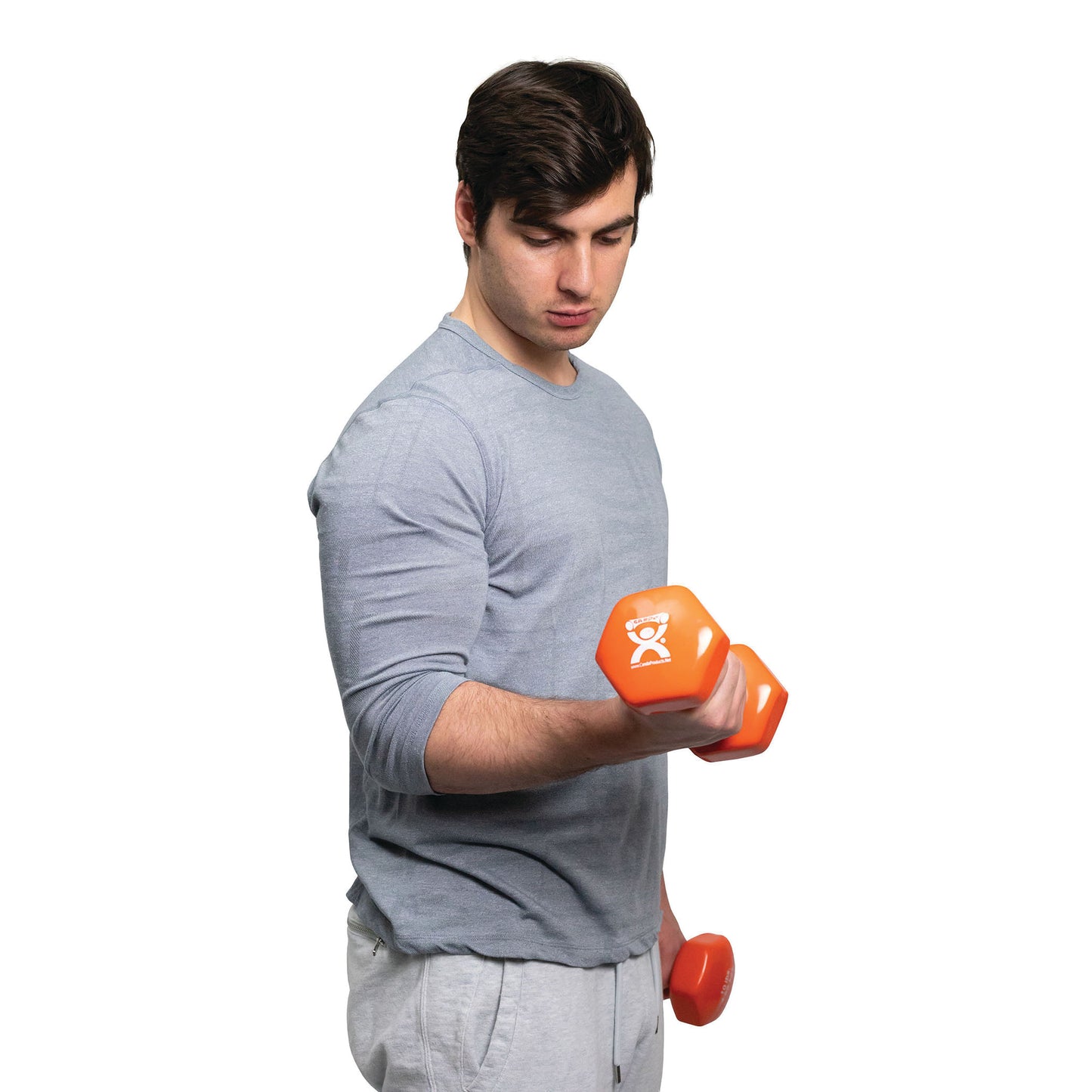 A man in a blue shirt lifts an orange CanDo Vinyl-Coated Dumbbell while standing against a white background.