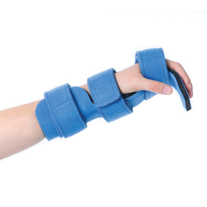 A person's hand is secured in a Comfy Splints Adult Hand/Wrist Orthosis, featuring blue padded straps and a molded support.