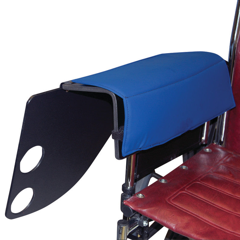 The SkiL-Care Flip-Top Tray with Cup Holder is attached to a wheelchair armrest, featuring a blue padded cover and two holes.