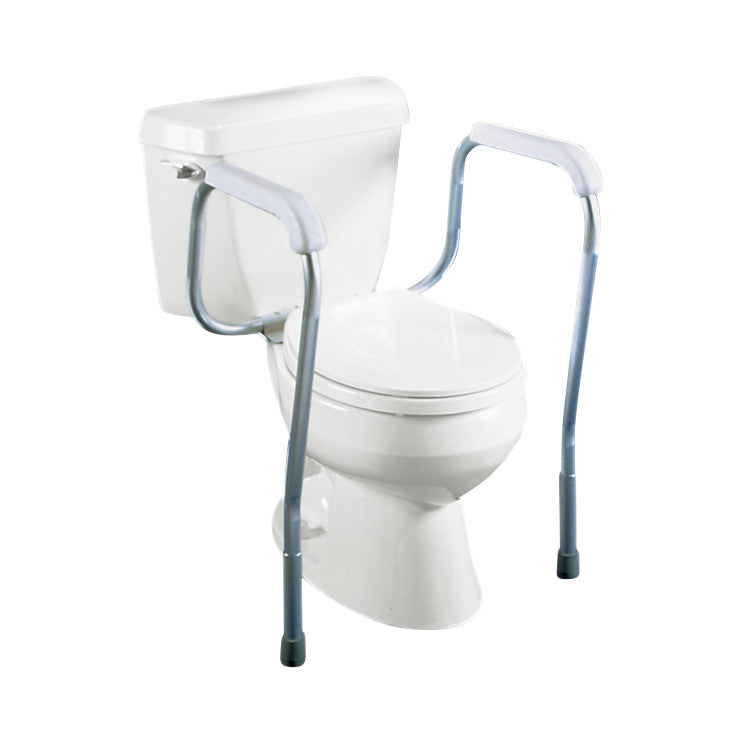 A white toilet equipped with a Drive Medical Adjustable Toilet Safety Frame featuring armrests for added support and stability.