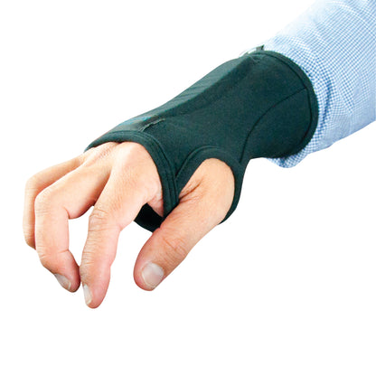 A person wearing a Brownmed IMAK RSI SmartGlove wrist support, designed to relieve wrist pain, over a blue checkered shirt.