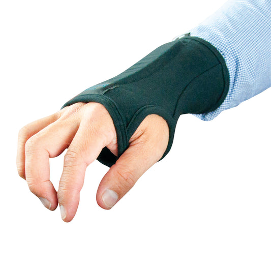 A person wearing a Brownmed IMAK RSI SmartGlove wrist support, designed to relieve wrist pain, over a blue checkered shirt.