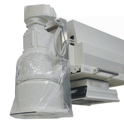 A medical machine is partially covered with a TIDI Band Bag Equipment Cover, featuring a clear protective plastic wrap.