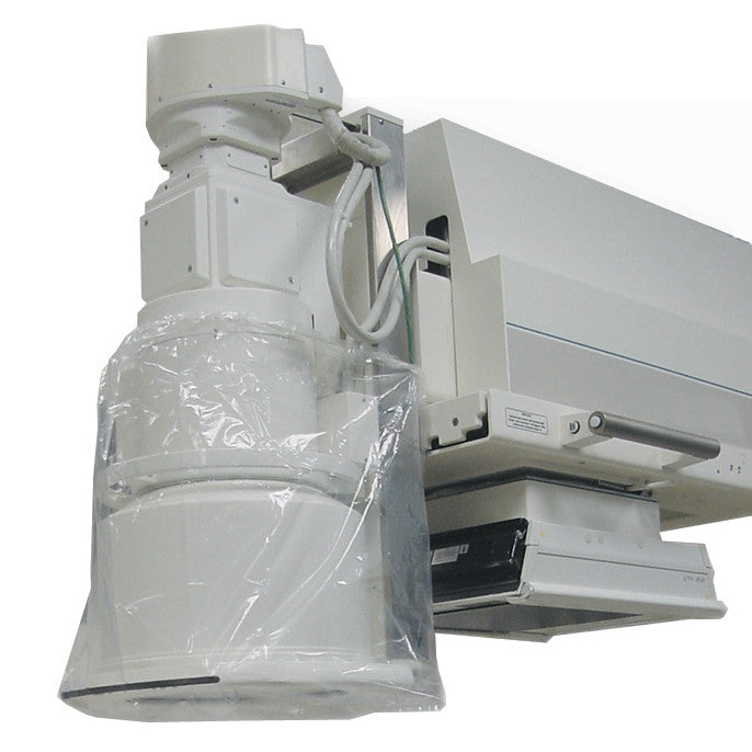 Medical imaging equipment partly covered with a clear TIDI Band Bag Equipment Cover, showing handles and a control panel.
