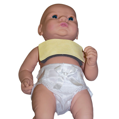 A doll wearing a Pediatric AttenuRad CT Breast Shield and a white diaper with a bow, lying down with arms slightly raised.