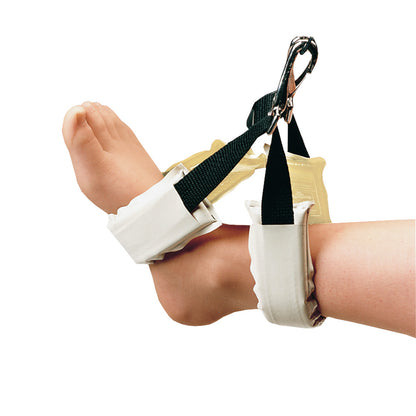 A child's feet secured in AliMed AliGel Ankle Stirrup Pads with black straps and clips, against a white background.