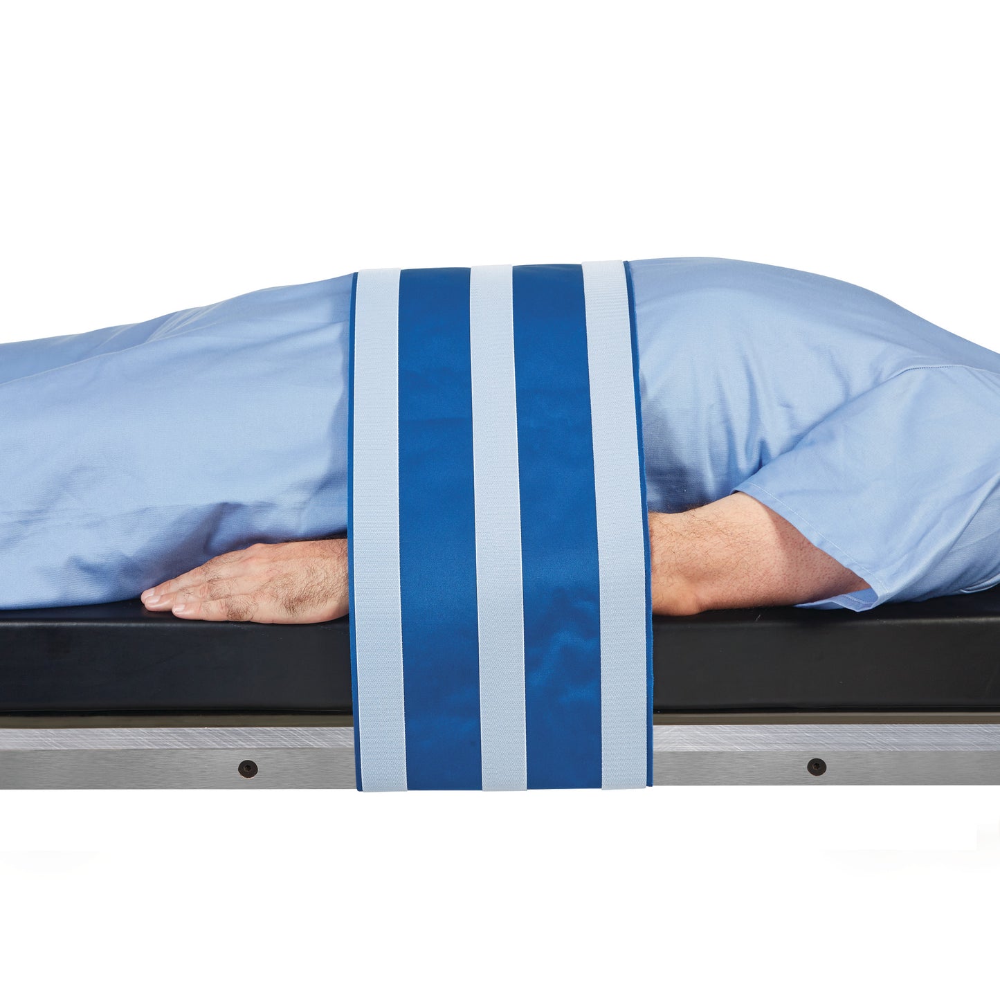 A person lies face down on a table secured with the AliMed AliStrap Positioning Strap, featuring blue and white stripes.
