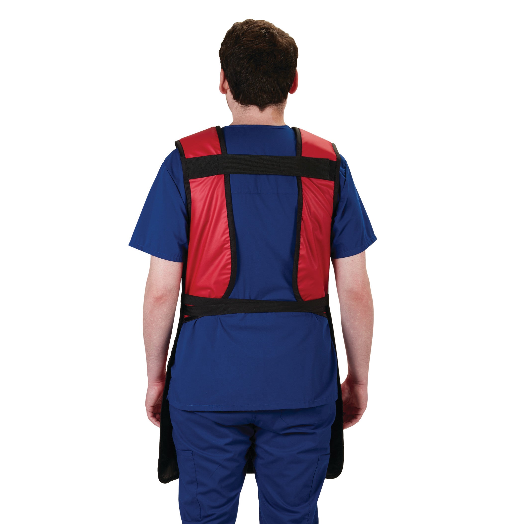 A man wears the AliMed Grab n Go Tie Apron, Male. The apron is red with black straps, worn over blue medical scrubs.