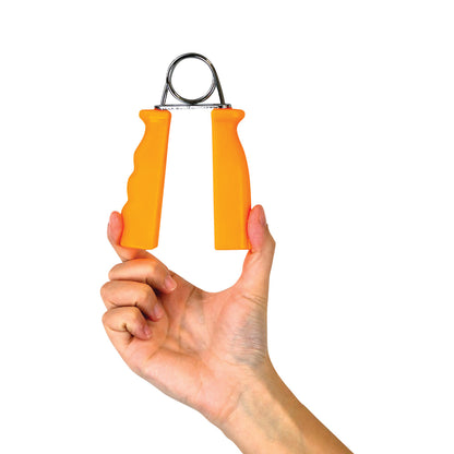 A hand holds a CanDo Fixed Resistance Grip Exerciser with orange handles and a metal spring, against a white background.