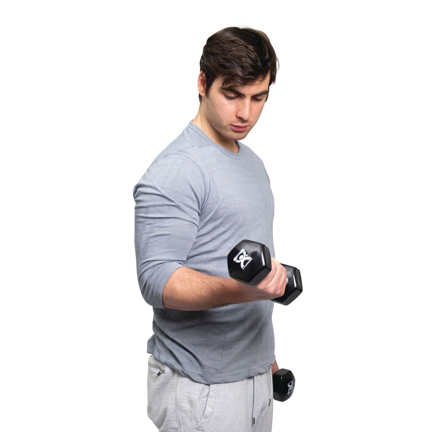 A person lifts a dumbbell from the CanDo Vinyl-Coated Dumbbell Set, wearing a light gray shirt and pants on a white background.