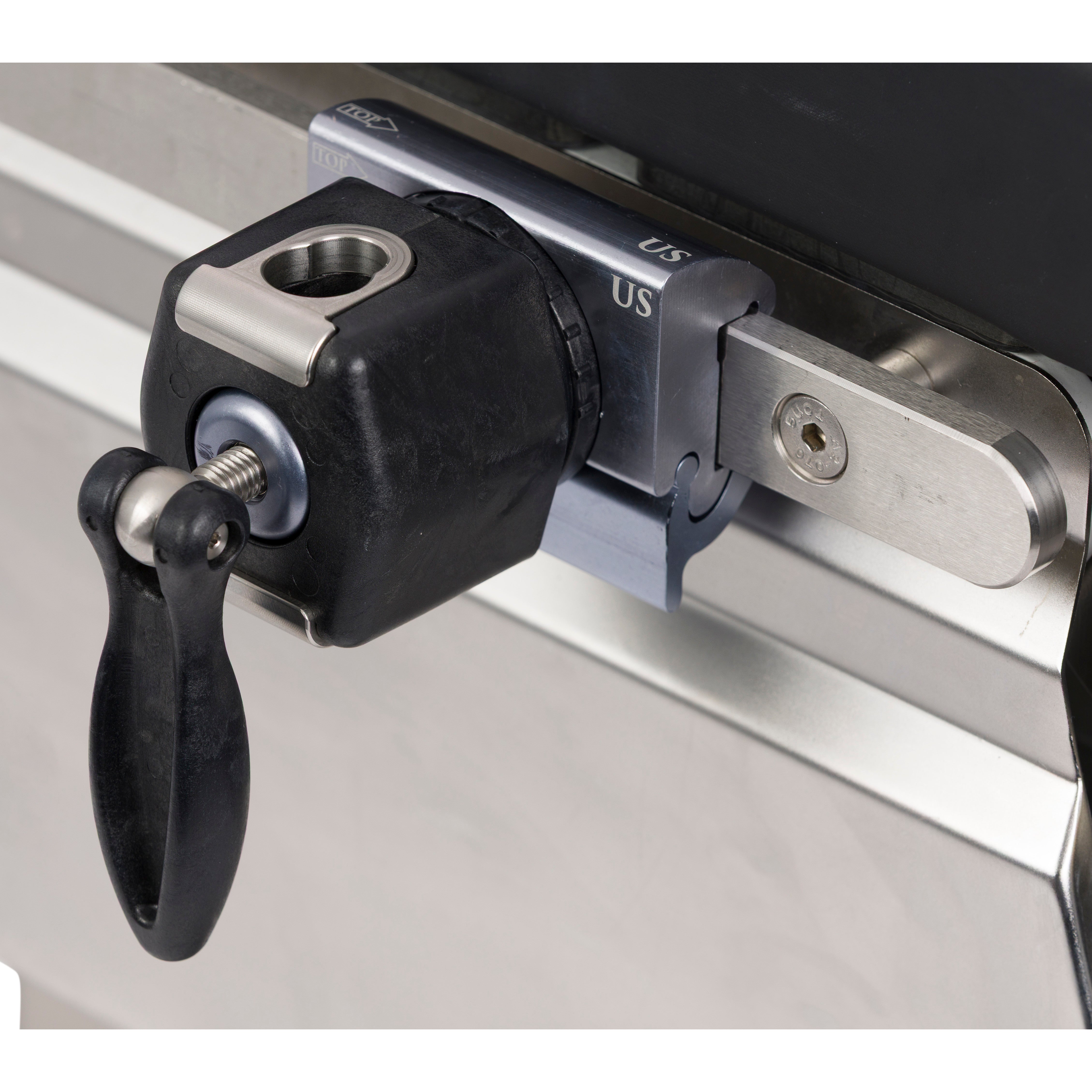 Kyra SocketLok Clamp for U.S. Side Rail secures a black knob to a metallic rail with "US" engraved, featuring a locking mechanism.