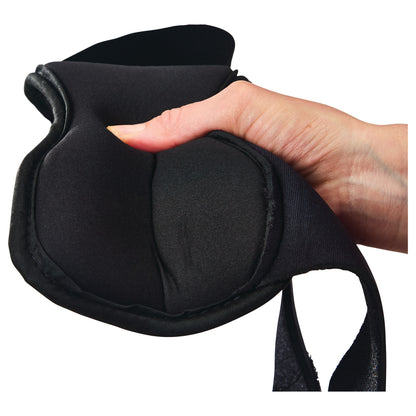 A hand grips an AliMed FREEDOM Dorsal PF Night Splint, showcasing its soft, padded black material and adjustable design.