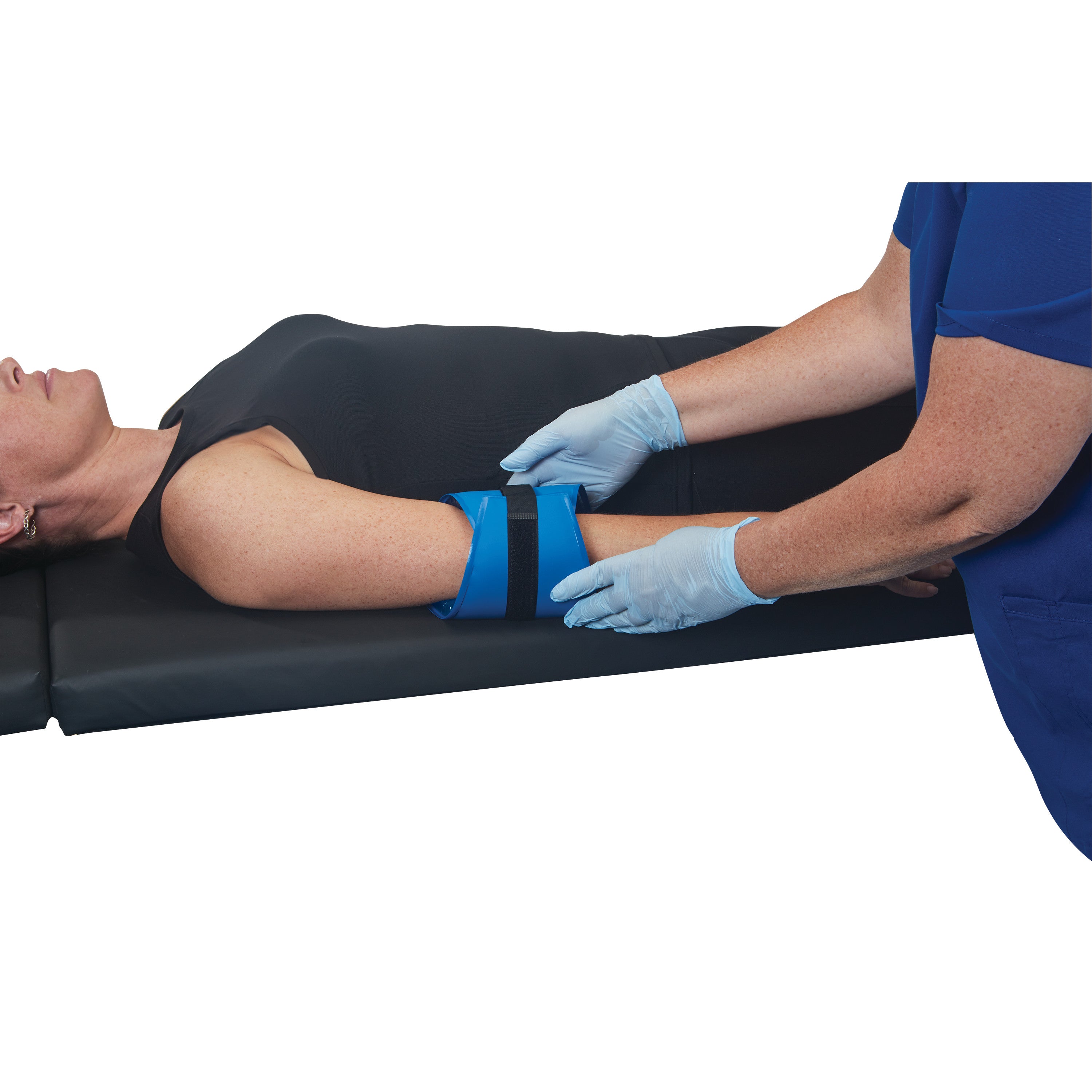 A person lying on their back has the AliMed AliBlue Gel Ulnar Nerve Protector placed on their arm, secured by a strap.