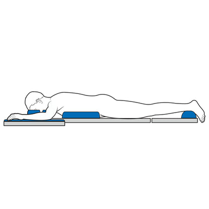A person lies face down using the AliMed AliBlue Gel Prone Positioning Set, including head, chest, hip, and foot supports, on a flat surface.