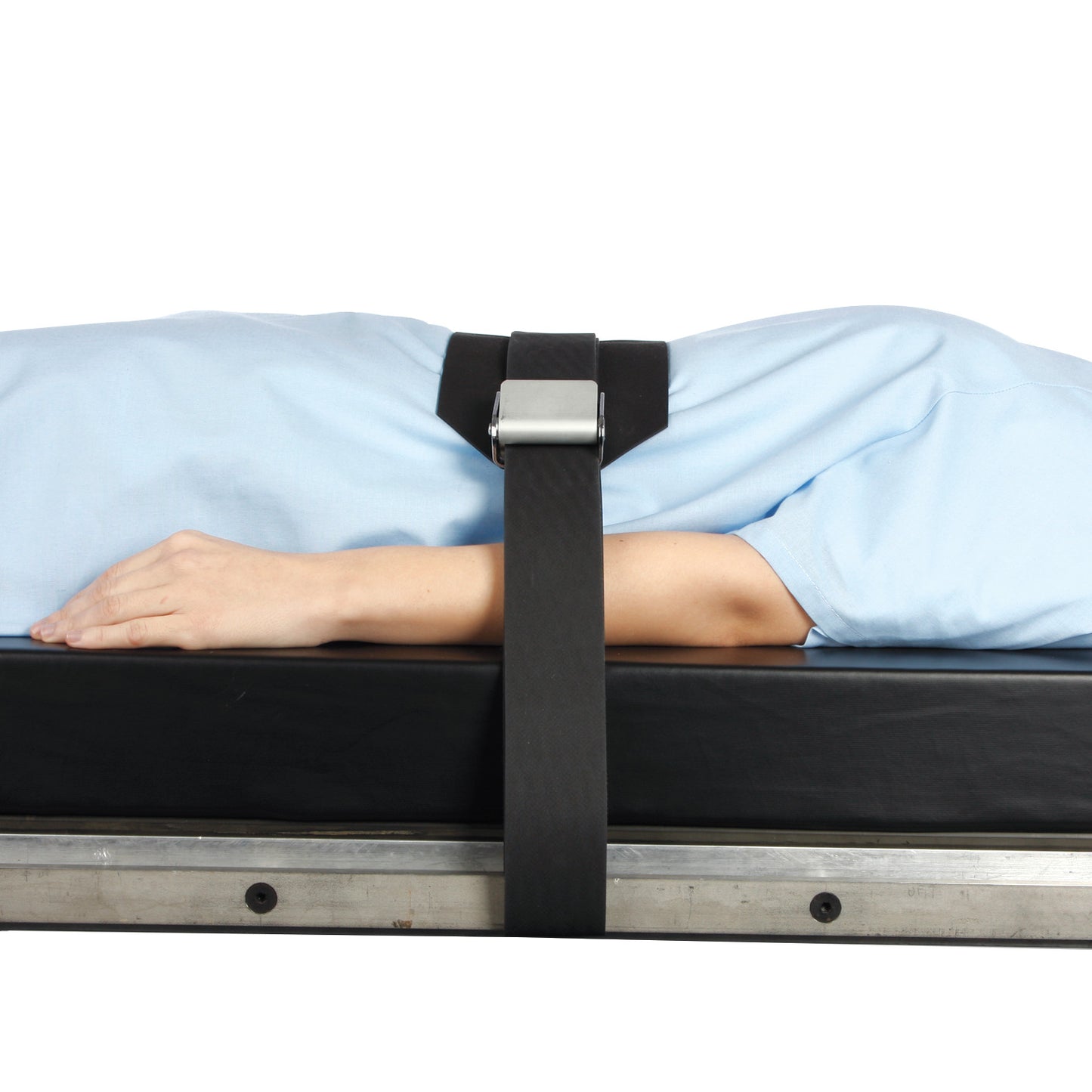 Person secured on a table with an AliMed Wipeable Operating Room Table Strap, showcasing a black strap and a metal buckle.